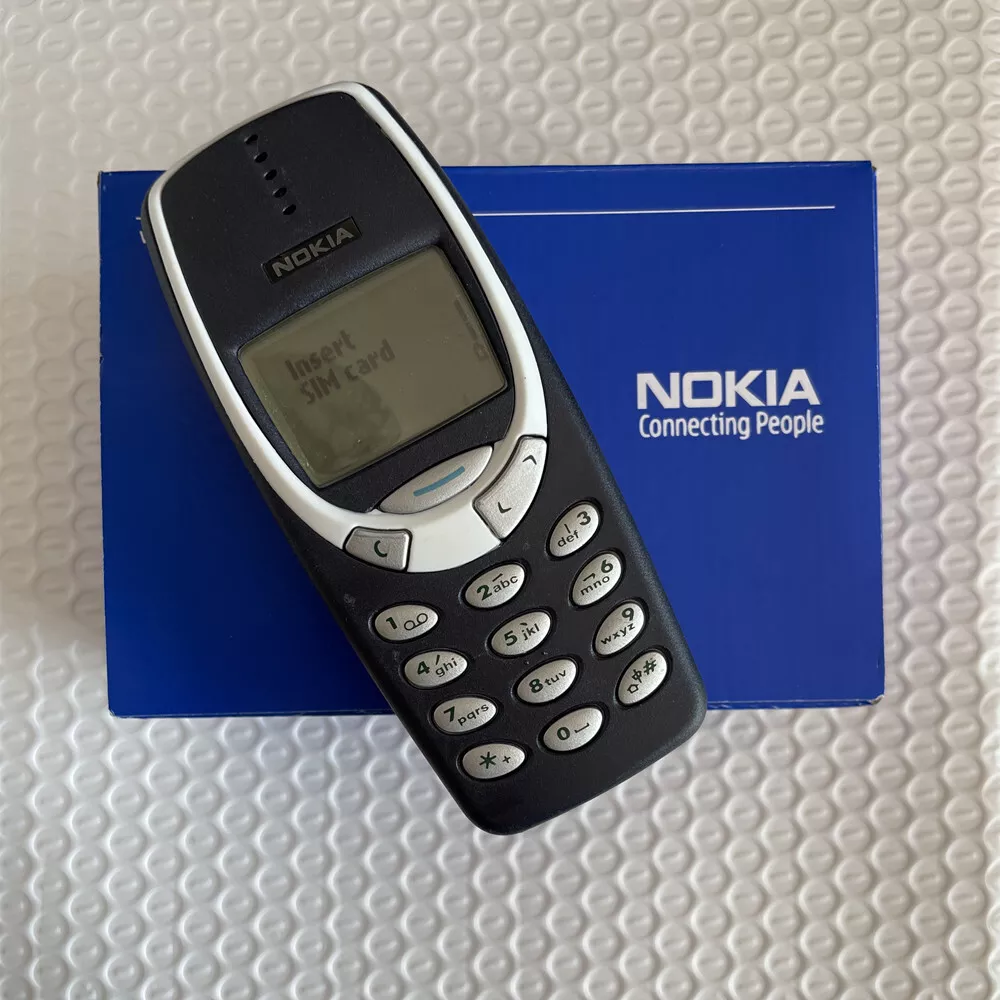 A person plays the classic mobile game Snake as the new Nokia 3310