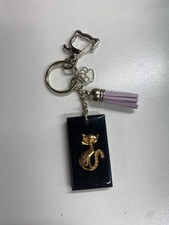 ELEGANT FELINE KEYCHAIN - CAT SILHOUETTE WITH PAW CHARM