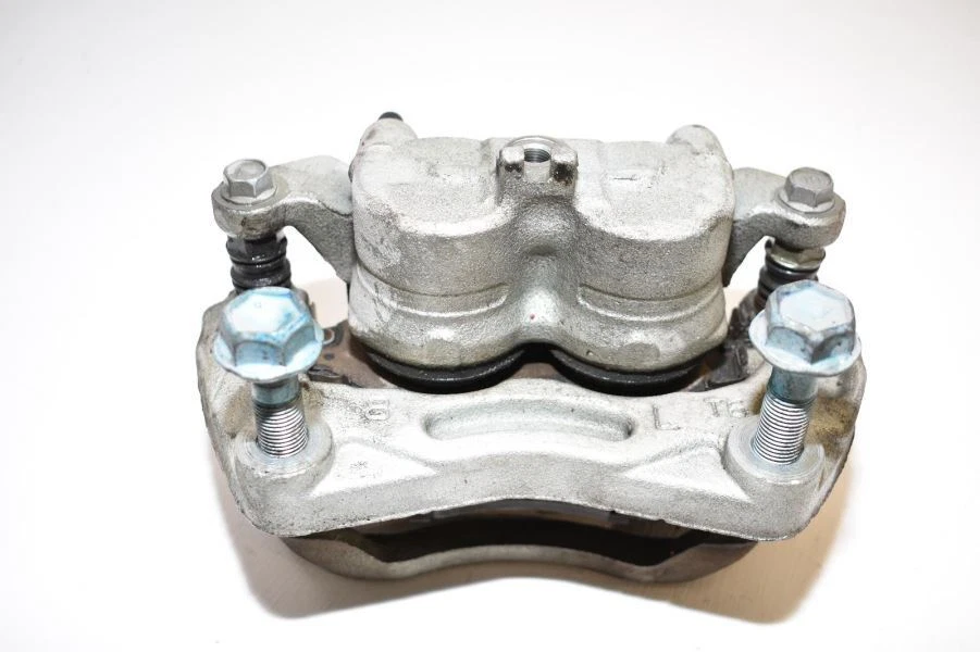 Nissan 370Z Fairlady 2009-2018 base tracción trasera lado del conductor pinza delantera izquierda OEM Foto 2 de 4