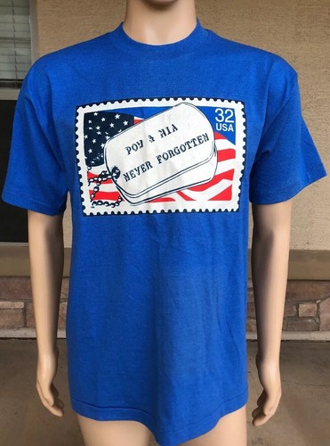 Blue EUC vintage 1995 T-shirt with white POW MIA Never Forgotten stamp and red, white, and blue USA flag design.