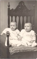 Postcard RPPC c1920 Baby INFANT TWINS on Wood Chair