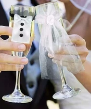 wine glasses with bride and groom decoration. 