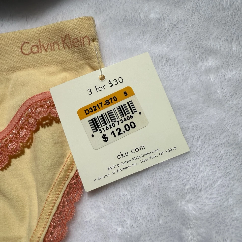 Женские желтые и розовые кружевные трусики-бикини Calvin Klein размер S новые с ценниками нераспроданные - Изображение 2 из 4