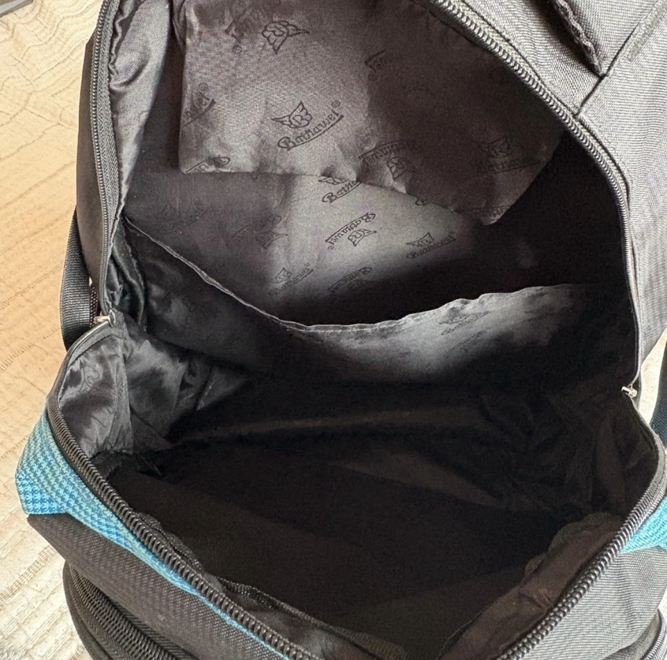 Mochila azul y gris con portabotellas de agua y varios compartimentos Foto 4 de 4