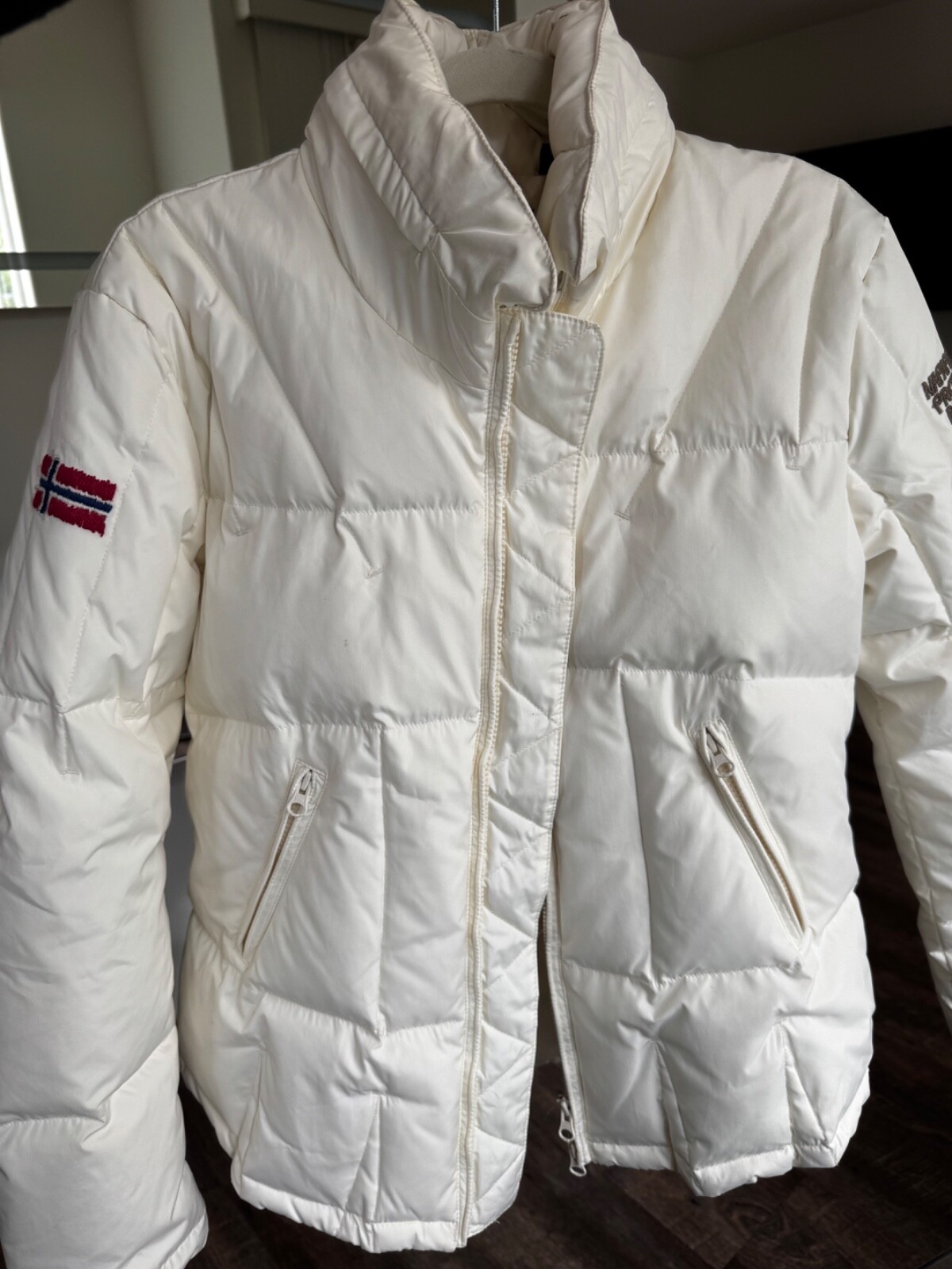 Stylish high-quality down jacket for girls with classic cut