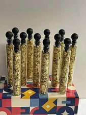   GOLD FLAKES IN 12 GLASS VIALS  NO LIQUID