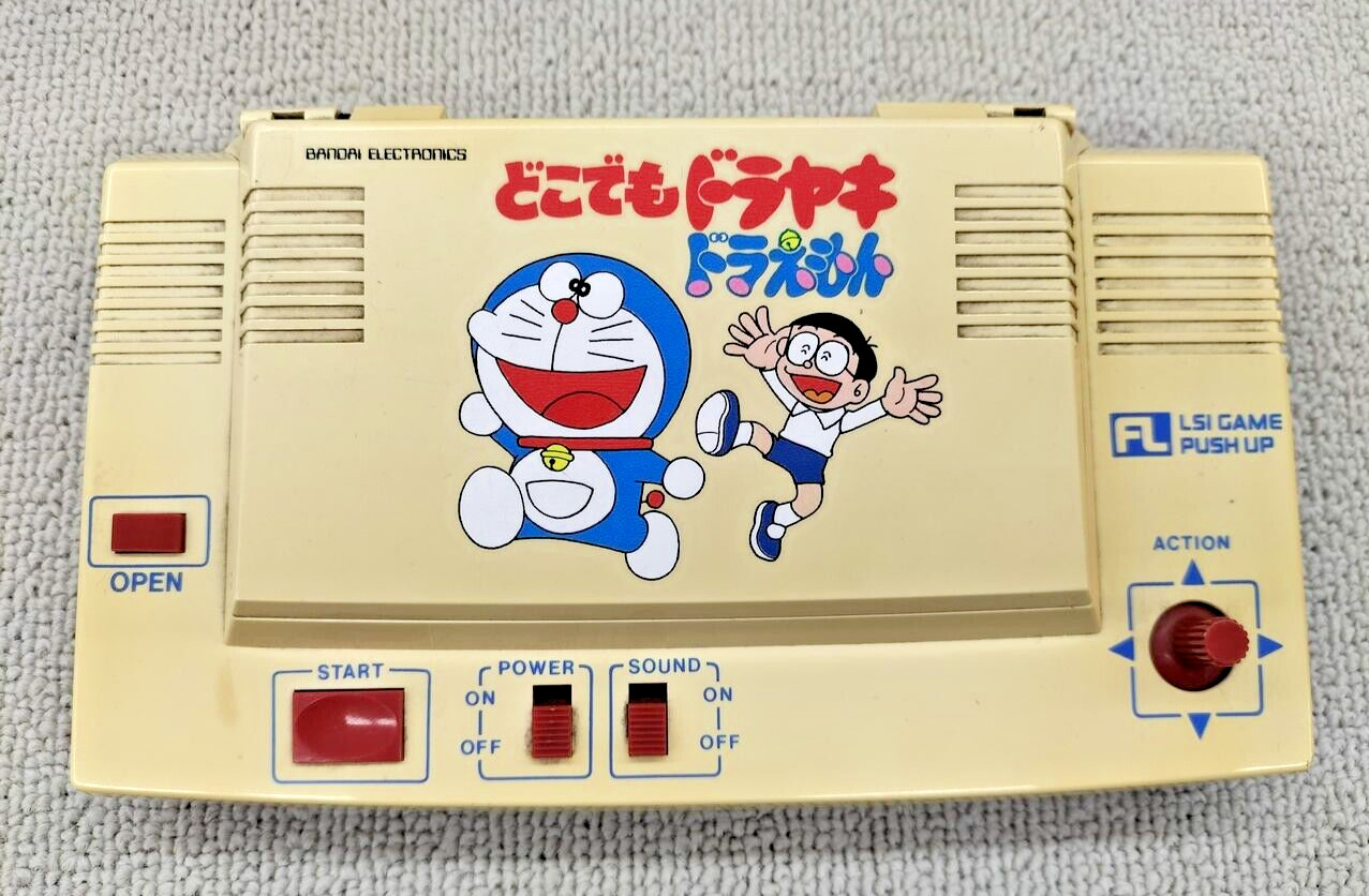 LSI Juego Push Up Doraemon Anywhere Dorayaki Juego Probado OK De Colección 1983 BANDAI