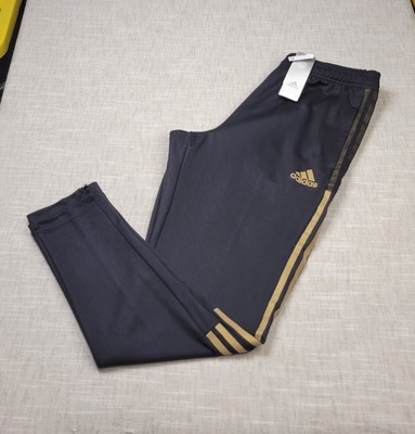 black and gold tiro pants