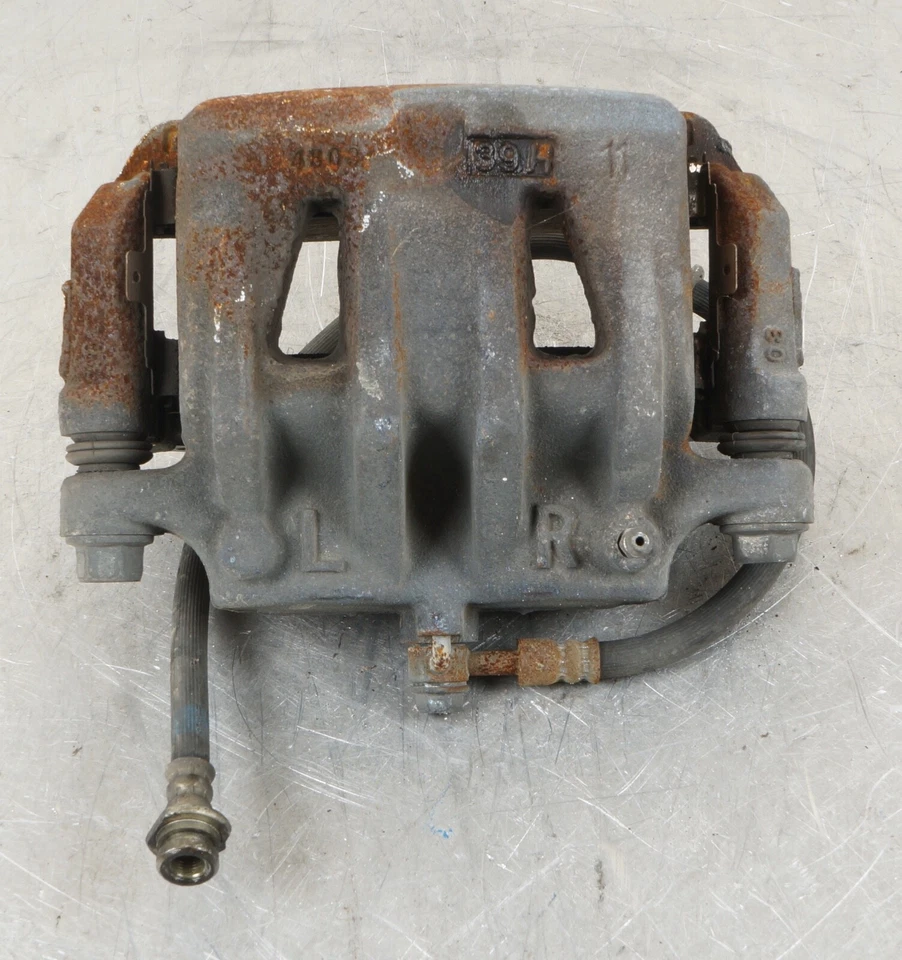 Pinza de freno delantera derecha Nissan Quest 2011-2017 OEM Foto 2 de 4