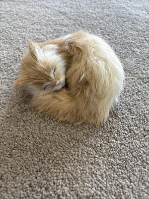 Vintage sleeping beige and white cat made of rabbit fur