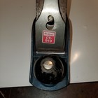 Vintage Blackhawk C557MP wood hand plane with flat rectangular base, silver blade guard, and red “CT-910 Made in U.S.A.” label.
