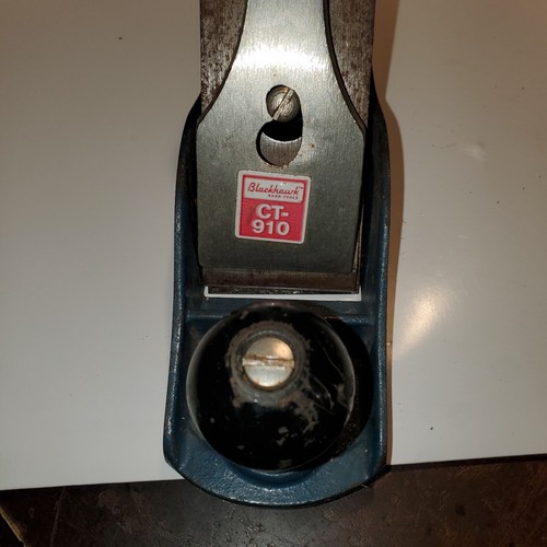 Vintage Blackhawk C557MP wood hand plane with flat rectangular base, silver blade guard, and red “CT-910 Made in U.S.A.” label.