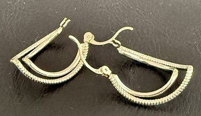 Accessorize silver coloured hoop earrings.