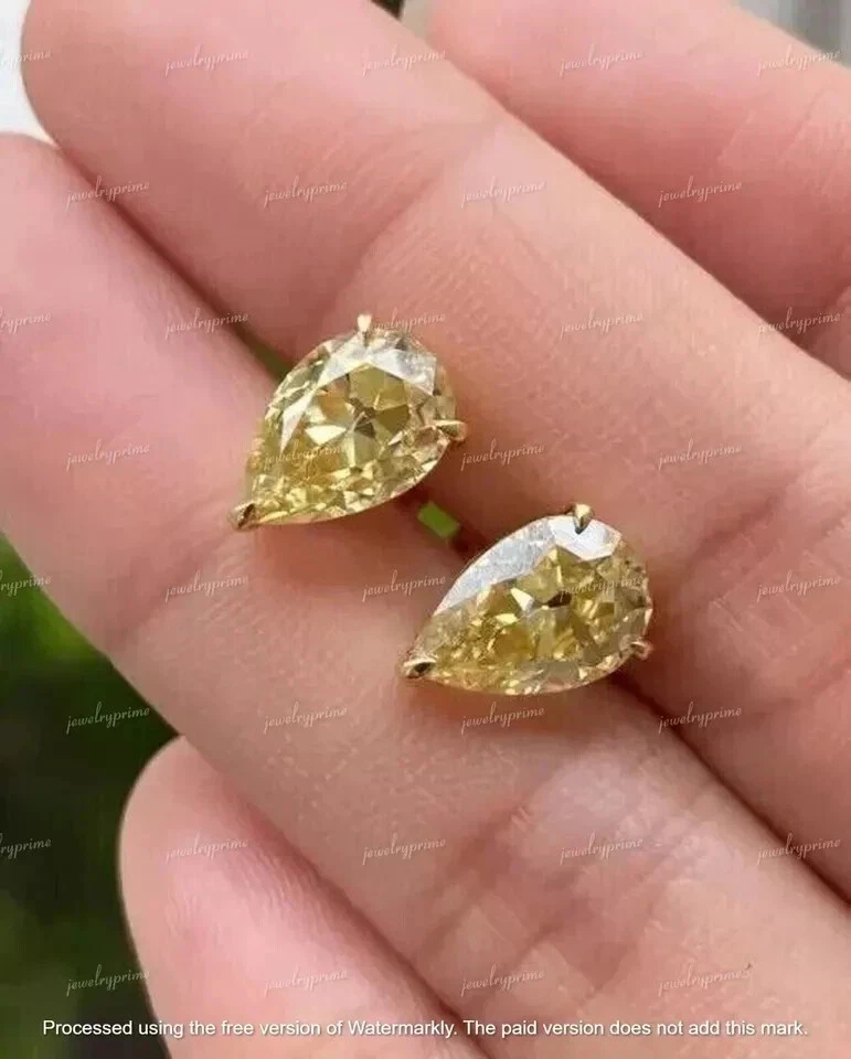 Aretes de citrino amarillo creados en laboratorio con corte de pera de 4 quilates acabado en oro amarillo de 14 quilates Foto 3 de 3