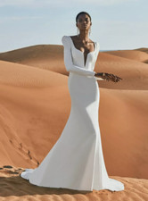 Pronovias wedding dress mermaid sweetheart neckline and long sleeves