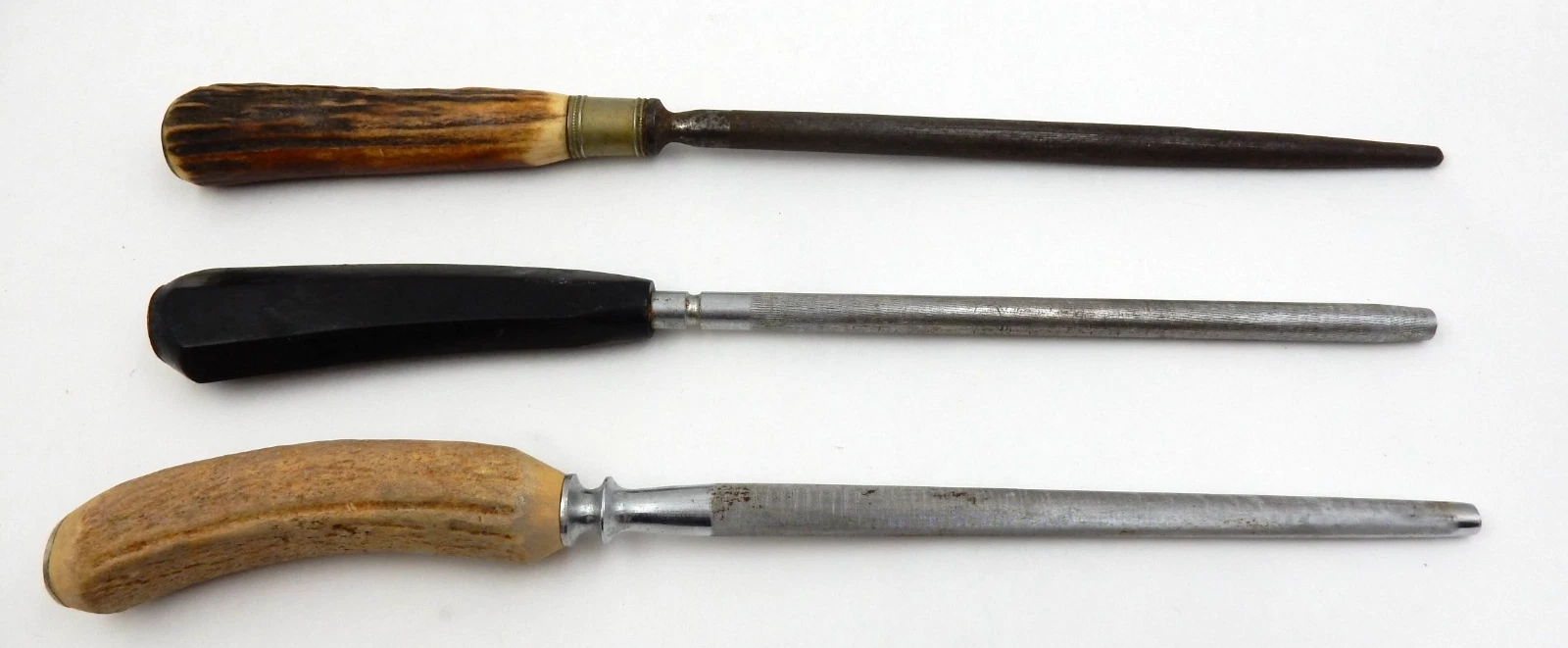 VINTAGE SET OF 3 STEEL KNIFE SHARPENERS; STAG HANDLES (2) & BLACK BAKELITE (1)