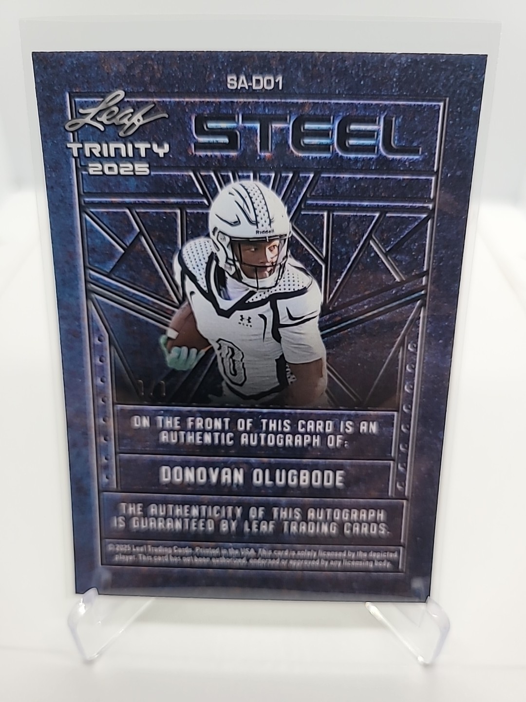 2025 Leaf Trinity Football Donovan Olugbode Auto 1/1 Steel Gold Prismatic view 2