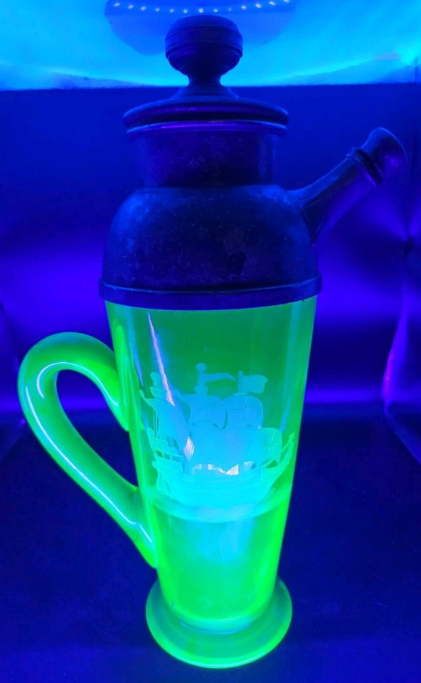 A uranium vaseline glass cocktail shaker with an etched ship that actually glows under UV light — this is the most unhinged, wonderful vintage barware item most people have never heard of.