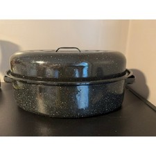 Granite Ware 15-inch oval roaster pan with a lid, speckled black enamel finish.