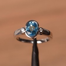 1.20Ct Lab-Created Blue Topaz Three-Stone Engagement Ring 14K White Gold Plated