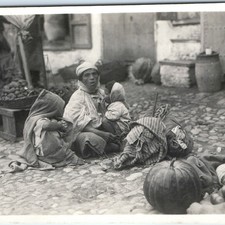 c1920s Unknown Market RPPC Ethnic Women Children Cobblestone Street Produce A358