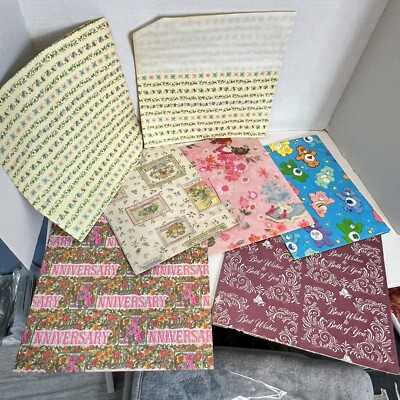 Vintage wrapping paper sheets, seven sheets some cut some whole