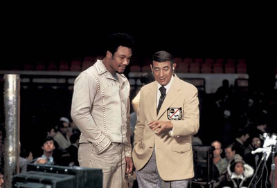 George Foreman with ABC Sports announcer Howard Cosell durin - 1974 Old Photo