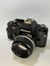 Nikon FG 35mm SLR Film Camera w/ NIKKOR f/1.8 Lens, Nikon Strap Cap