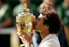 Roger Federer of Switzerland kisses the trophy after winning the M- Old Photo