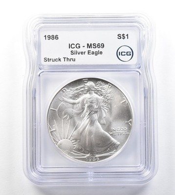 1986 American Silver Eagle Mint Error Struck Thru MS69 ICG *3292
