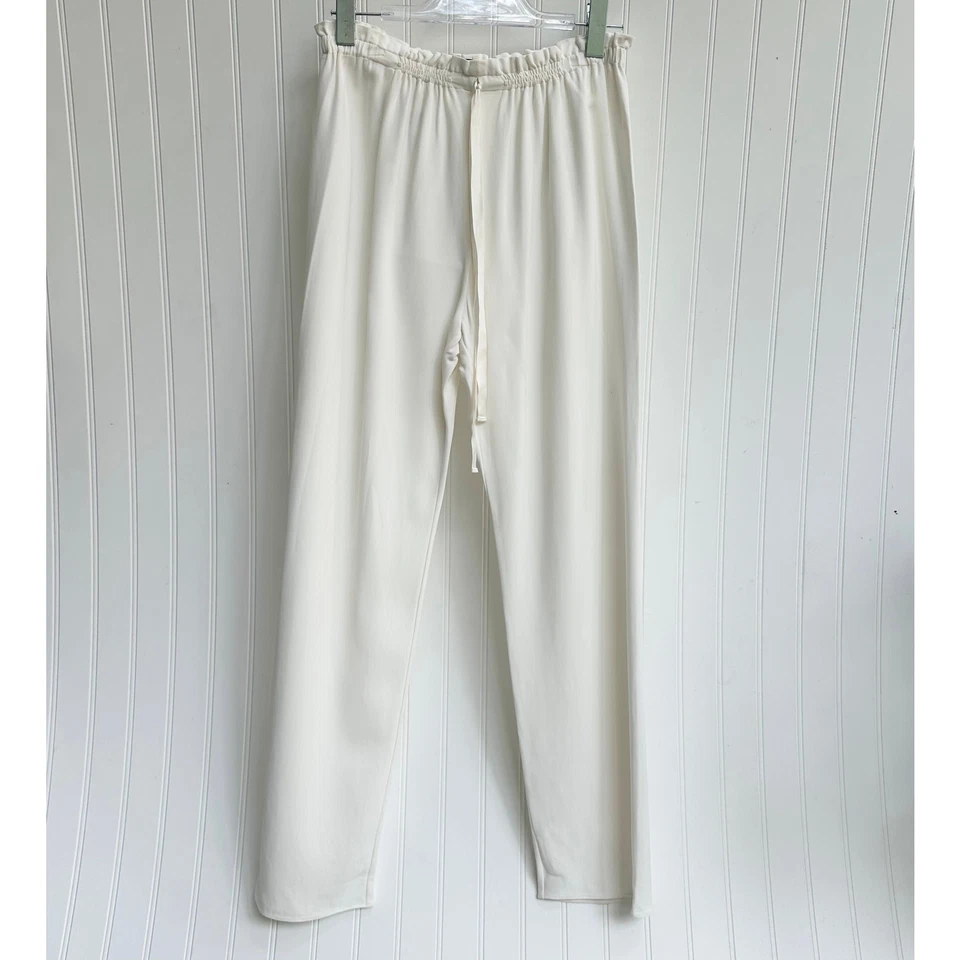 Pantalones de pierna recta relajados con cordón marfil The Row minimalistas de lujo pequeños Foto 2 de 4