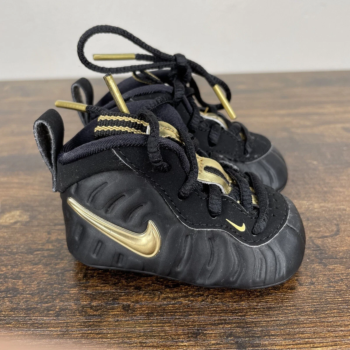 Infant black and sales gold foamposites