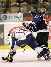 Anson Carter Primus Worldstars lays the lumber on Stefan Hel- Ice Hockey Photo