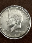 1966 50C Kennedy Half Dollar in capsule as seen in photos