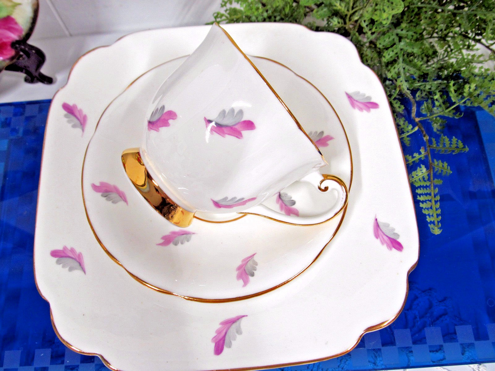 Clarence tea cup and saucer trio painted feather design pattern teacup England