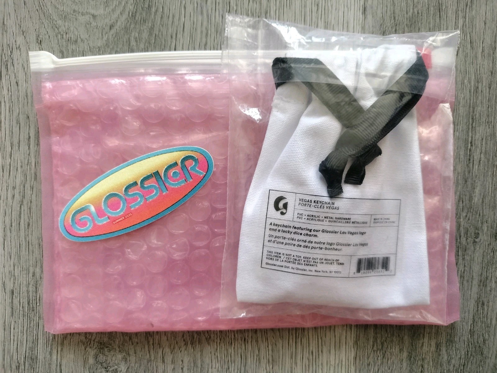 Limited Edition GLOSSIER Las Vegas Logo Dice Keychain + Sticker + Bubble Pouch 