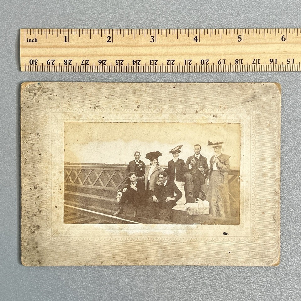 A 1900s Victorian photo of people staging a 'picnic' on a train trestle bridge — genuinely bizarre outsider history that makes you stop and stare.