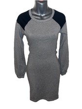 grey and black backless long sleeve dress with black detailing on shoulders