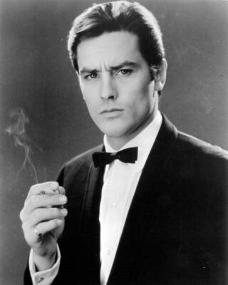 Alain Delon looks suave in tuxedo holding cigarette 1960's era 8x10 inch  photo