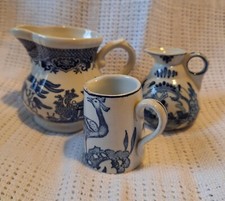 Antique blue and white delft and transfer print pottery jugs