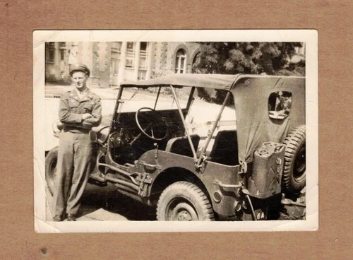 World War 2 Era Photo of a G.I. Next to a Jeep