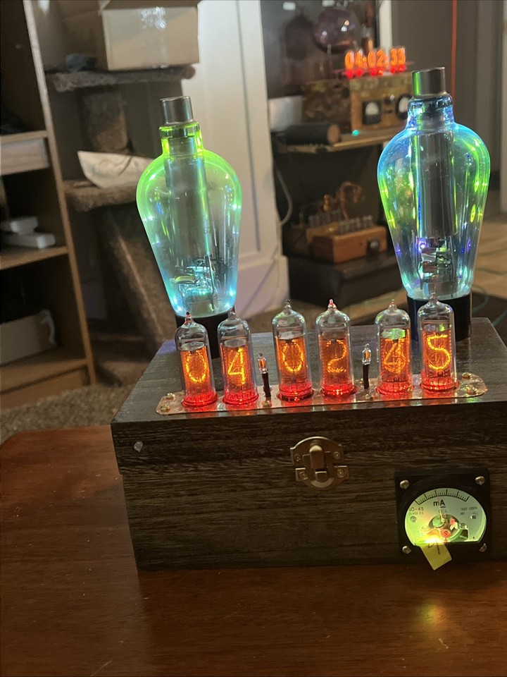 Minimalist Nixie clock with authentic IN-14 Russian tubes backlit by subtle LEDs — all the glow, none of the clutter, designed with real restraint.
