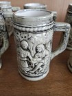 VINTAGE 1980s SET OF 9 MINI STEINS EMBOSSED FAMILY SCENES CERAMIC MUGS 3.5" TALL — photo 4