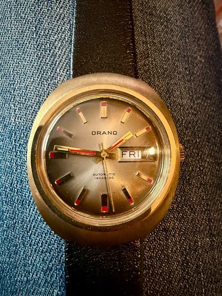 Montre Orano NOS Swiss Automatique day date rond vintage