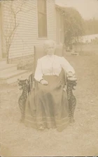 Antique RPPC Photo Postcard Older Woman Outside Interesting Roaring Tiger Chair