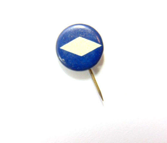 vintage very small pin featuring a white diamond on a blue field