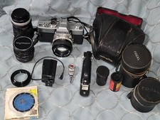 Minolta Srt-100. Camera W/ accessories  Extra lenses Leather Case with Strap