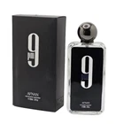 Black rectangular bottle of Afnan 9 PM Eau de Parfum with clear cap beside matching box displaying white “9 PM” text.