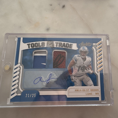 Panini 2022 Absolute Amon-Ra St. Brown Tools Trade Prime Auto MEM /25