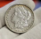 1884 US Morgan Silver Dollar $1 VF (Cleaned, Stained)